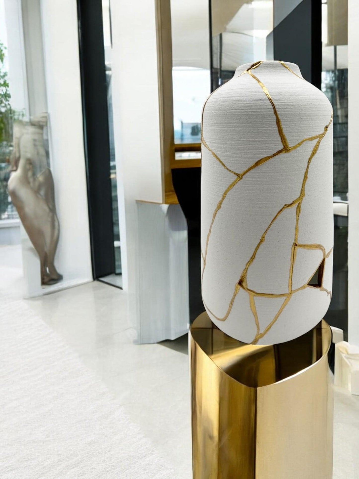 buy online luxury, bestseller, handmade, one of a kind, modern kintsugi japanese pottery art gift decorative cylinder vase for dried flowers in white with rough brushed horizontal texture and gold paint along break lines for sale
