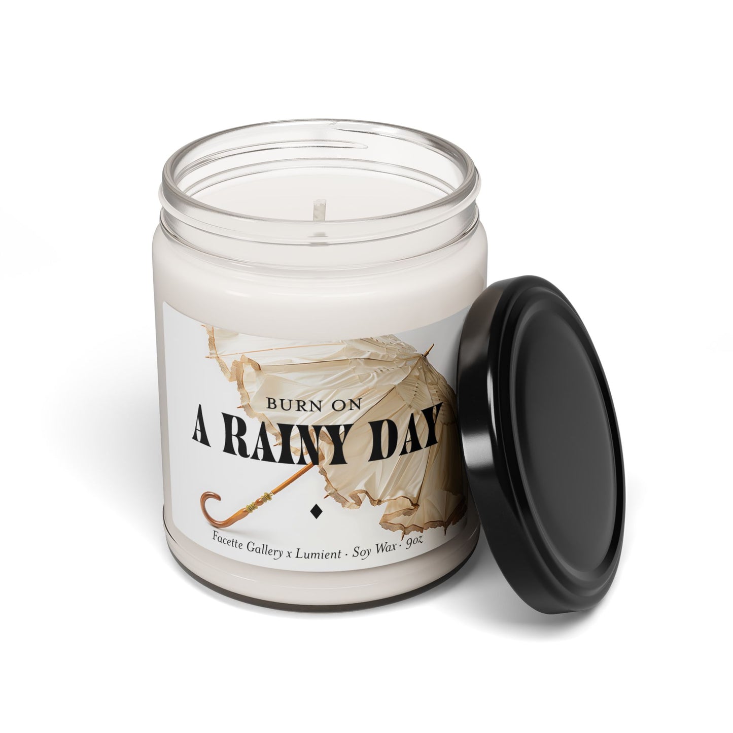 9oz soy wax candle in clear glass jar with black lid and umbrella design labeled "A Rainy Day