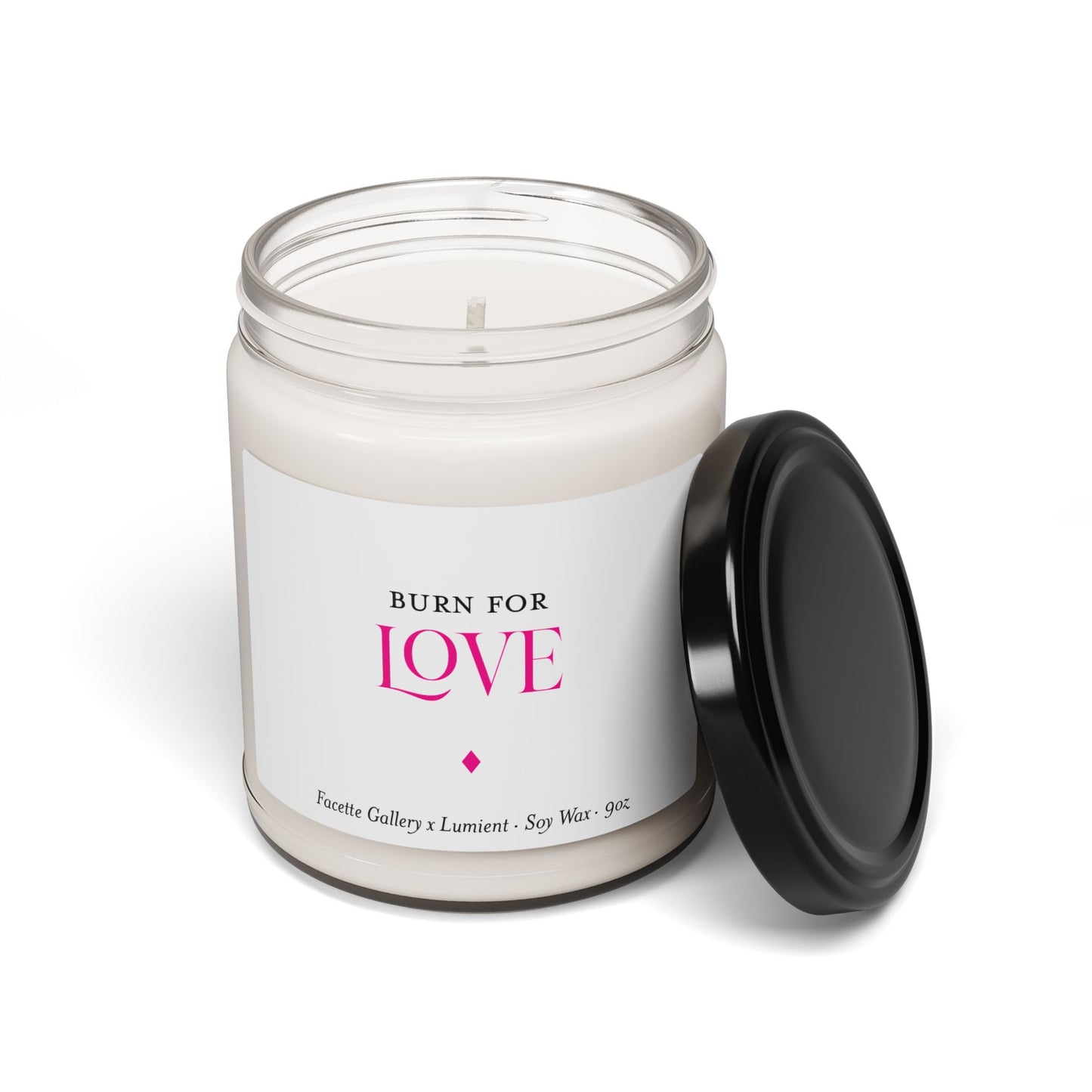 Burn for Love scented soy candle in 9oz clear glass jar with black lid, white wax, pink and black label design