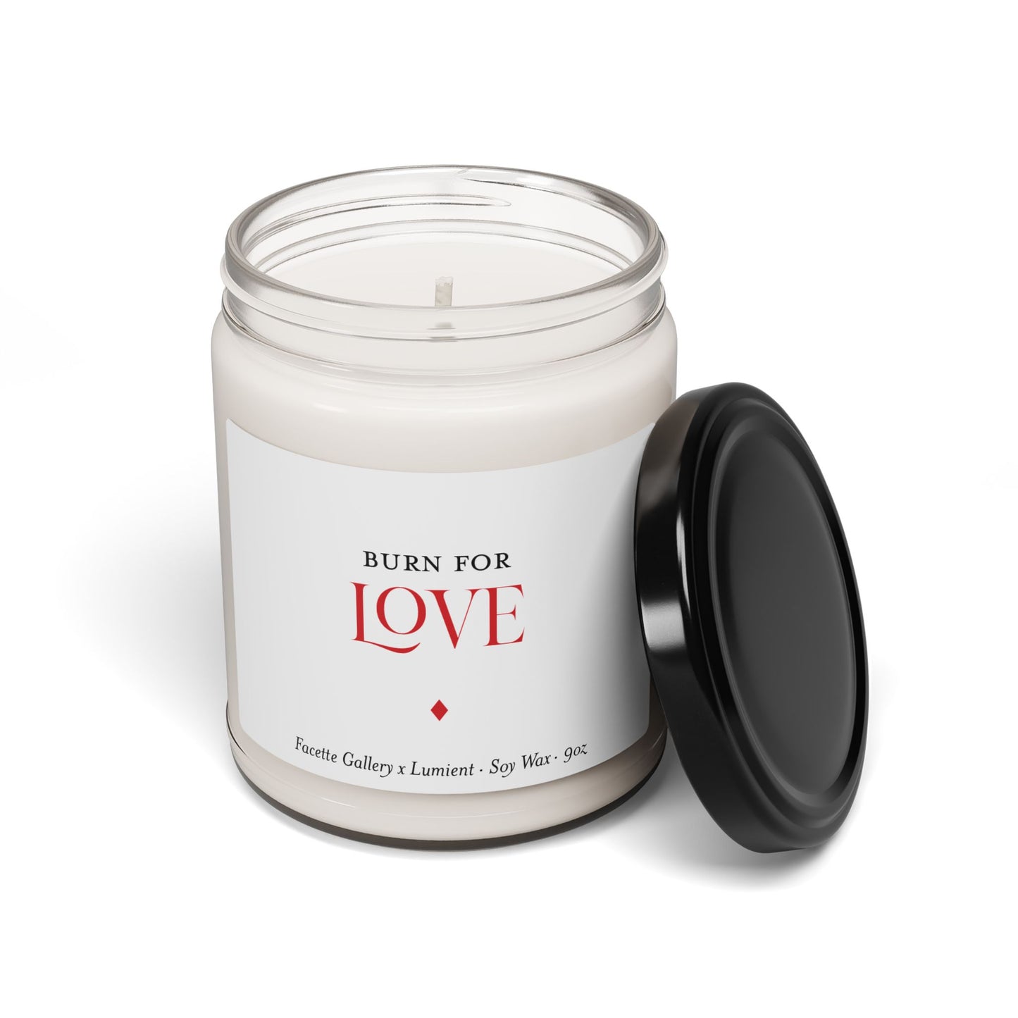Burn for Love scented candle in a clear 9oz glass jar with white soy wax and black lid on white background