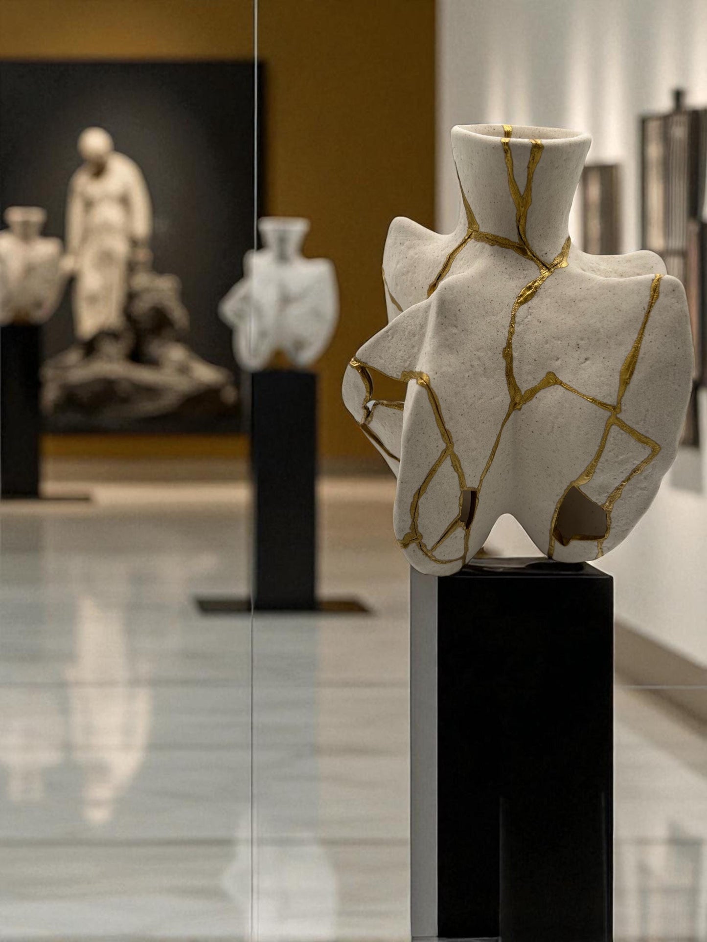 Modern Kintsugi fossil vase with hand-painted gold cracks on white pottery, displayed on black pedestal in gallery setting