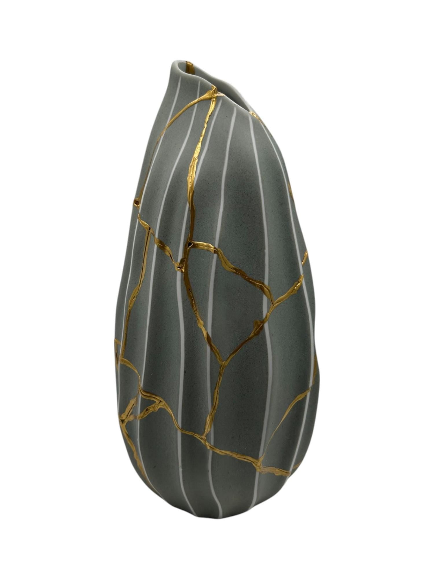 Modern Kintsugi Melon Vase with hand-painted gold repairs and vertical white stripes on green ceramic pottery