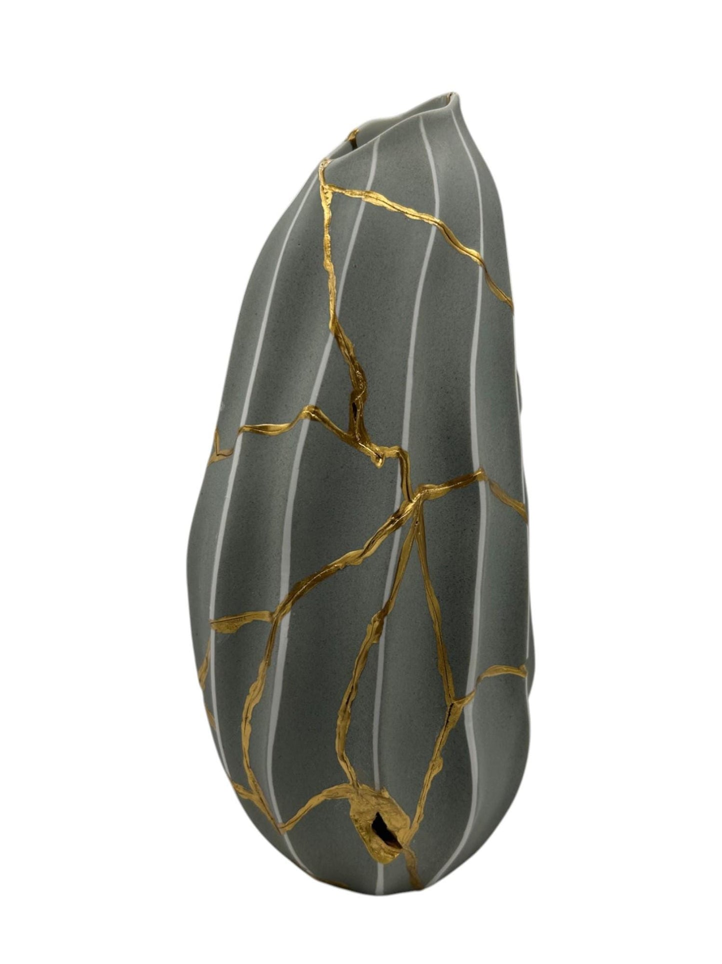 Modern gray melon-shaped kintsugi vase with vertical white stripes and hand-painted gold repaired cracks on white background