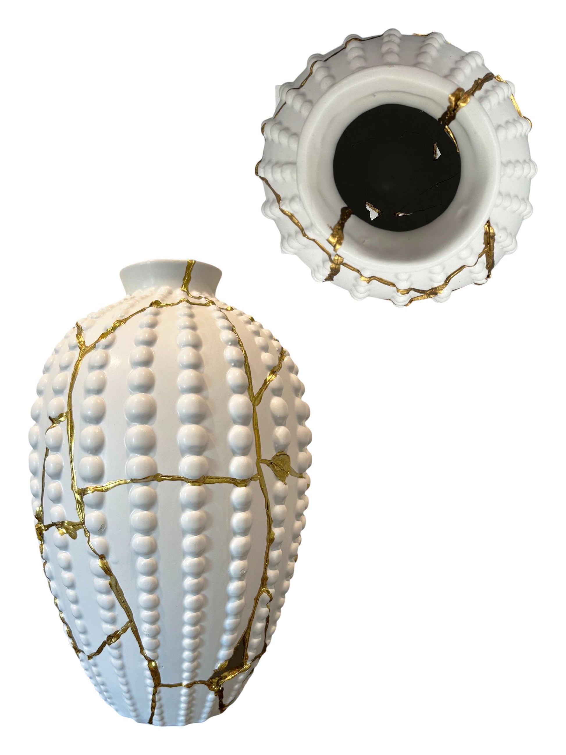 White ceramic sea urchin vase with raised dots and gold kintsugi repairs, shown from side and top views on white background