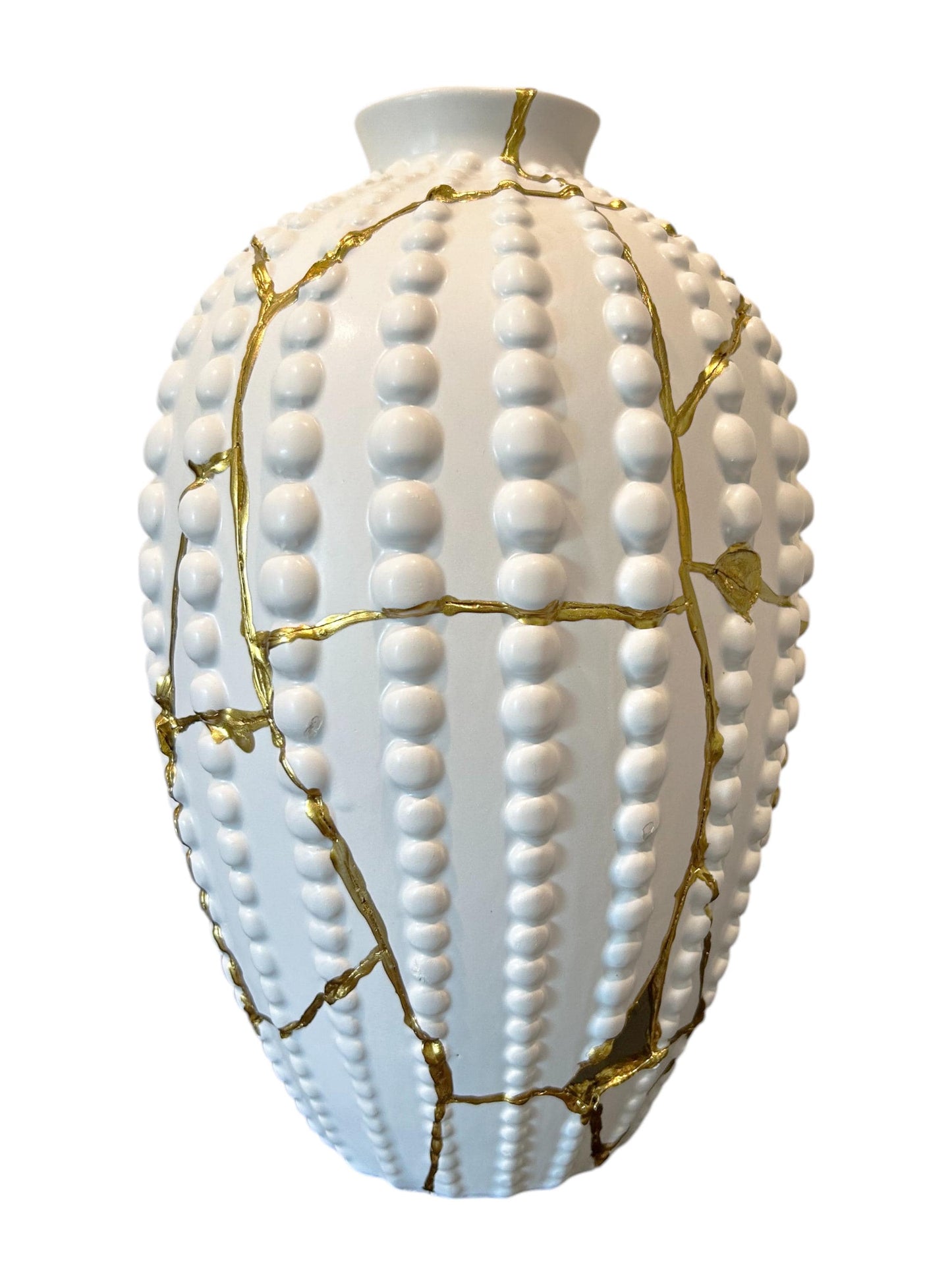 White sea urchin shaped ceramic vase with raised dots and gold kintsugi repair lines, 12.5 inches tall.