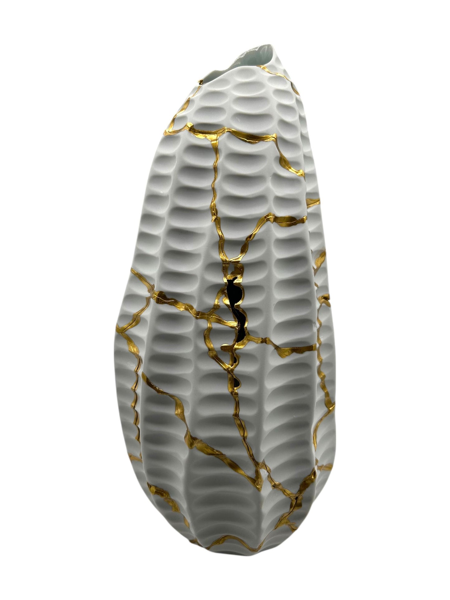 Handcrafted white ceramic Modern Kintsugi Seahorse Vase with gold repaired cracks and textured surface on white background