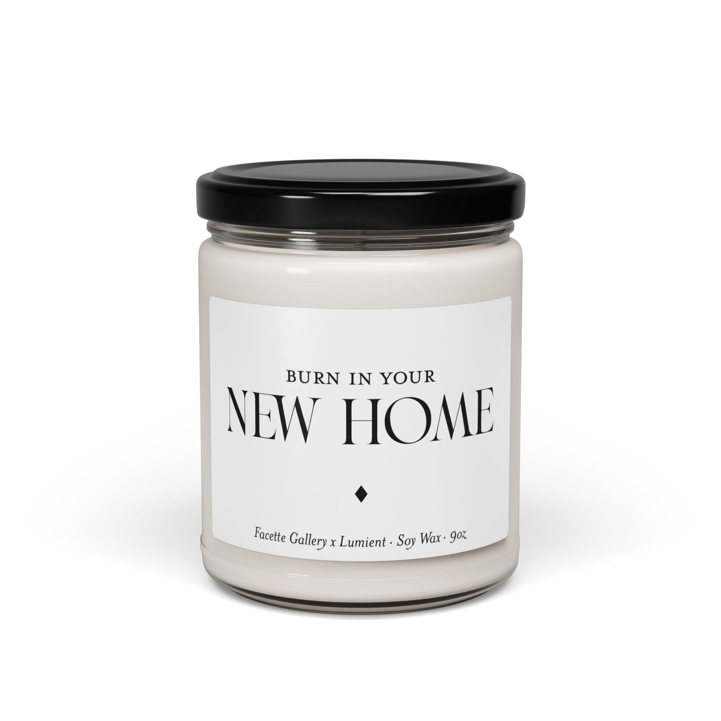 9oz white soy wax candle in clear glass jar with black lid and "New Home" label in black text