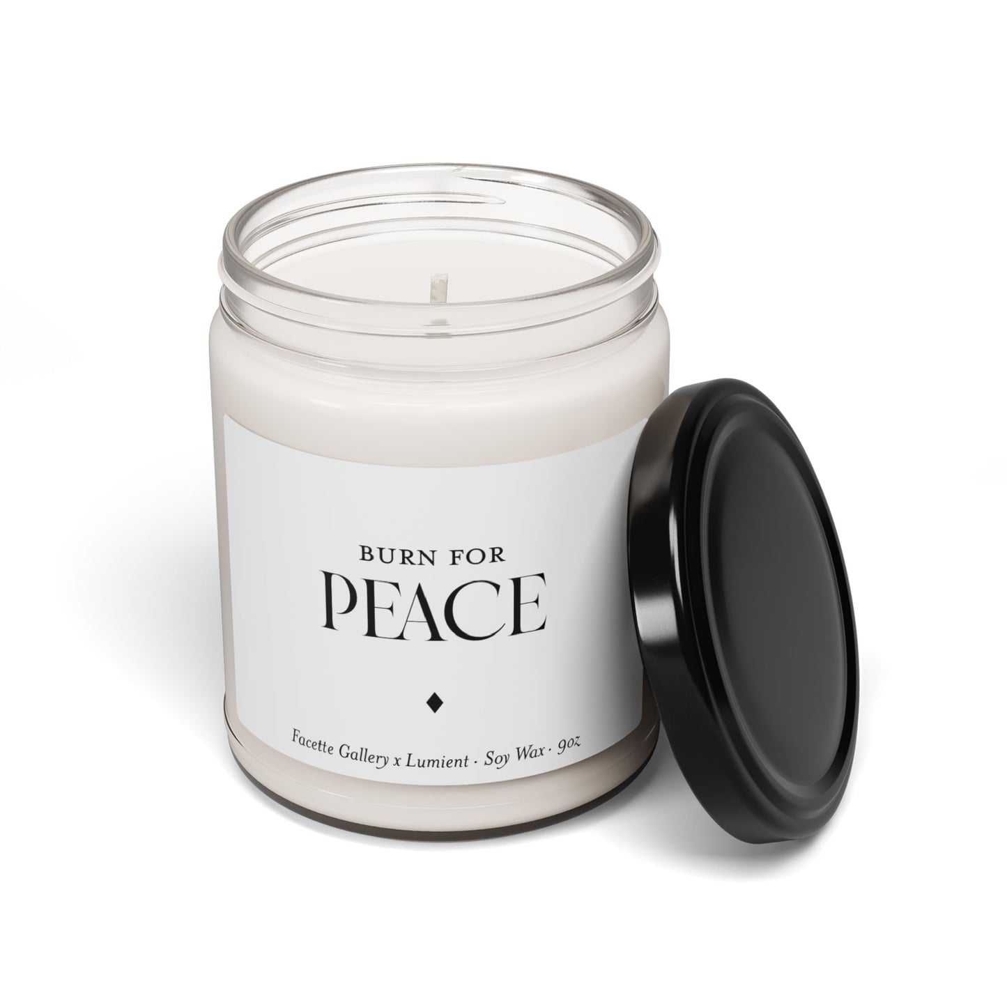 9oz white soy wax candle in clear glass jar with black lid and "Burn for Peace" label in black text