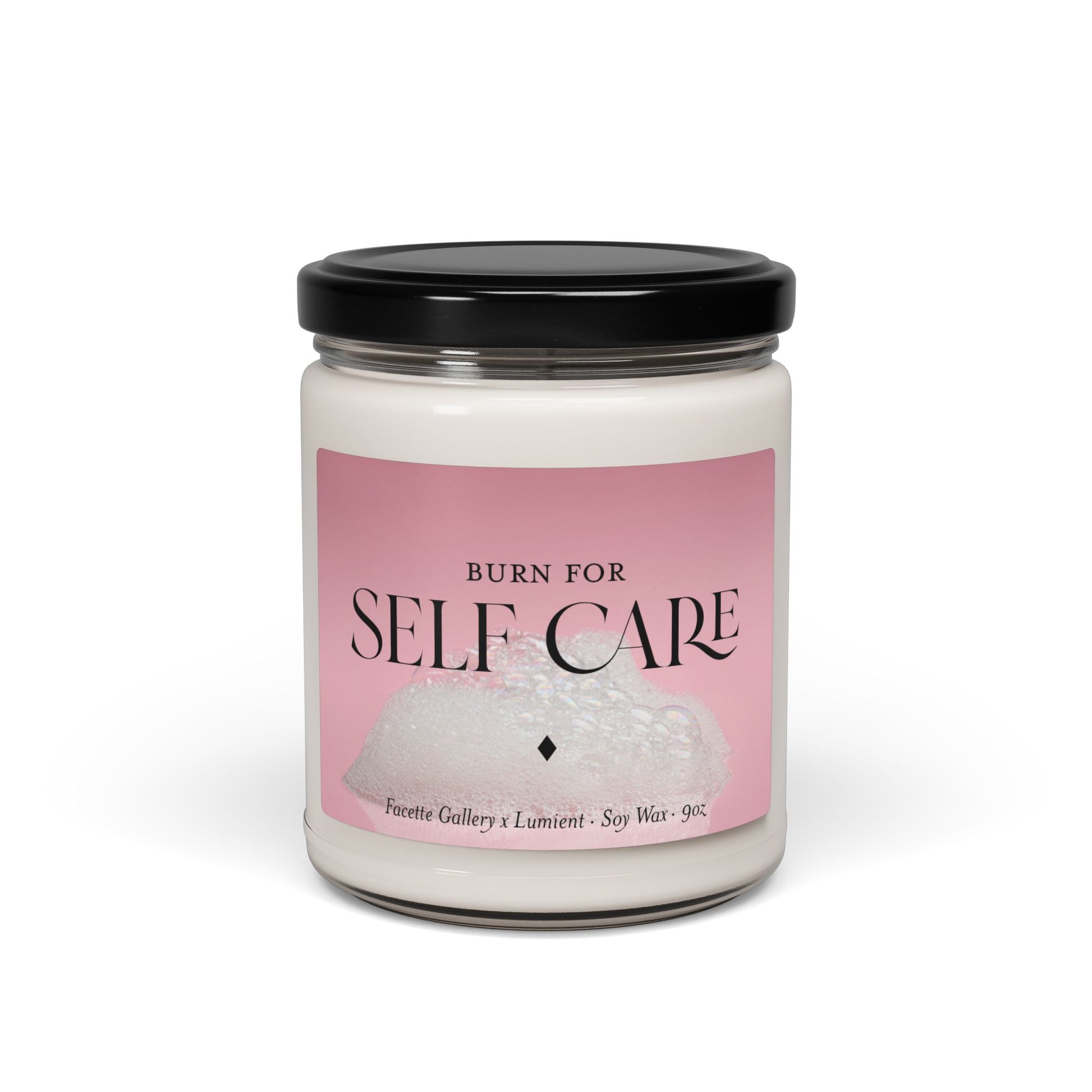 9oz self care candle in clear glass jar with black lid and pink bubble bath label, soy wax blend